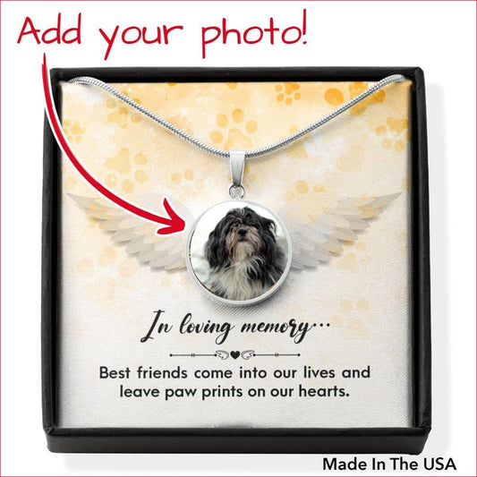 Best Friends Leave Paw Prints Memorial Stainless Steel Necklace is displayed in giftbox with instruction, "Add your Photo!" pointing to the pendant featuring a grey and white dog photo. Under the giftbox are the words, "Made In The USA"