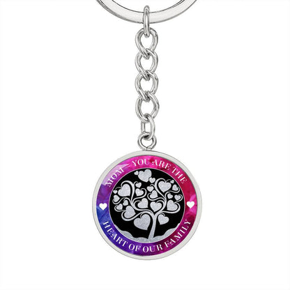 Mom - You are the Heart of our Family Keychain pendant hangs from short cable link chain which attaches to the keyring which is only slightly in view