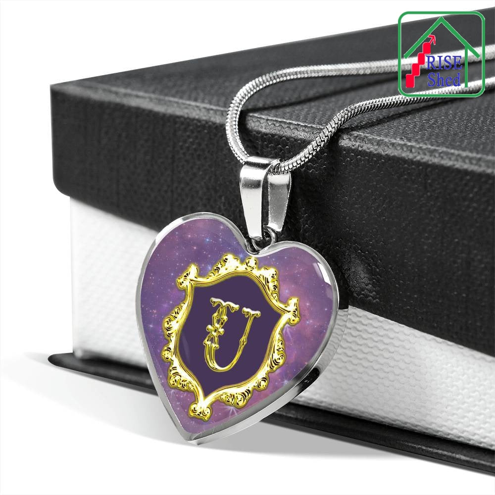 U Initial Monogram Alphabet Stainless Steel Heart Pendant and Necklace draped over giftbox