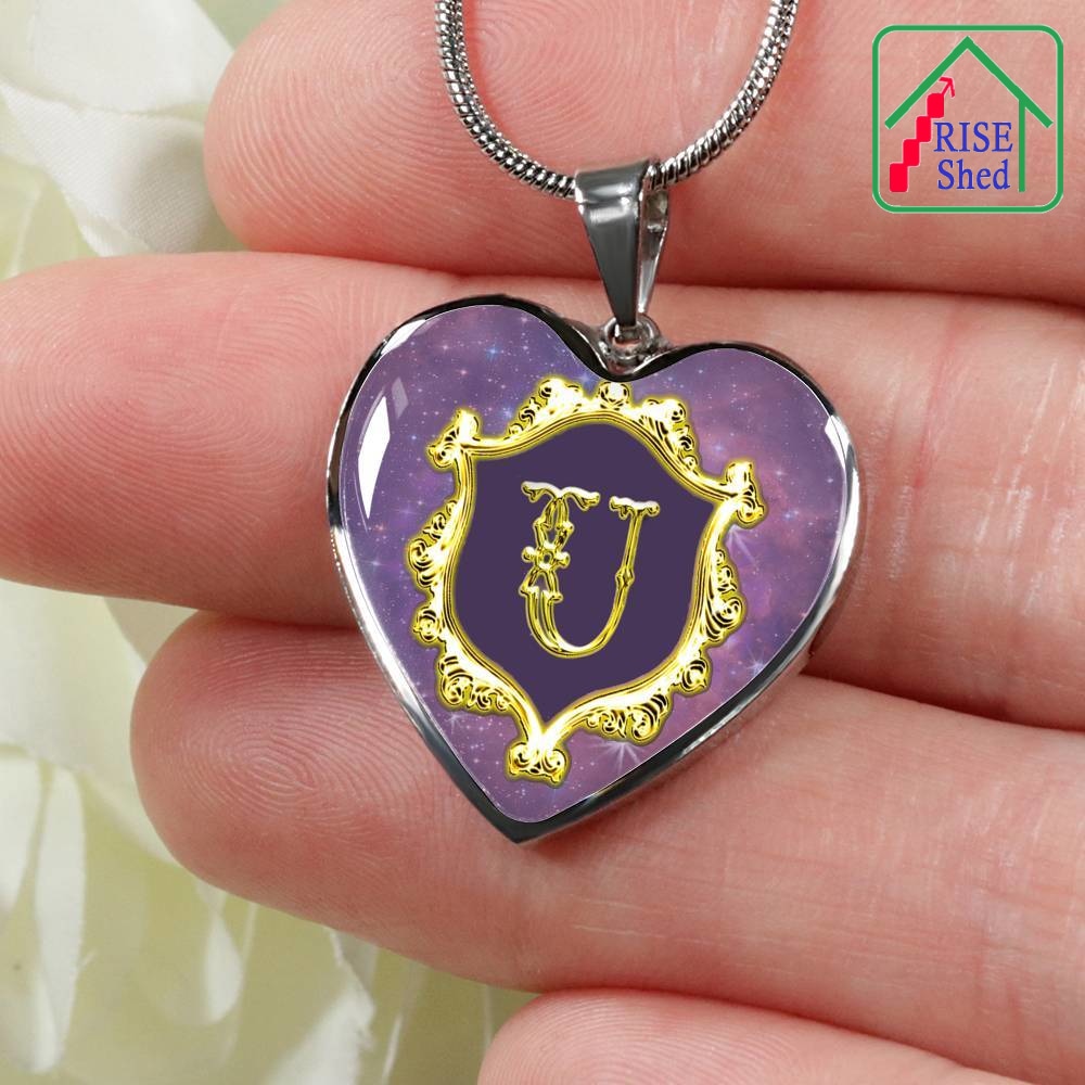 Close up of U Initial Monogram Alphabet Heart Pendant and Necklace being held in hand
