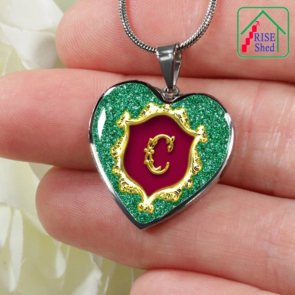 Close up of C Initial Monogram Alphabet Heart Pendant and Necklace being held in hand