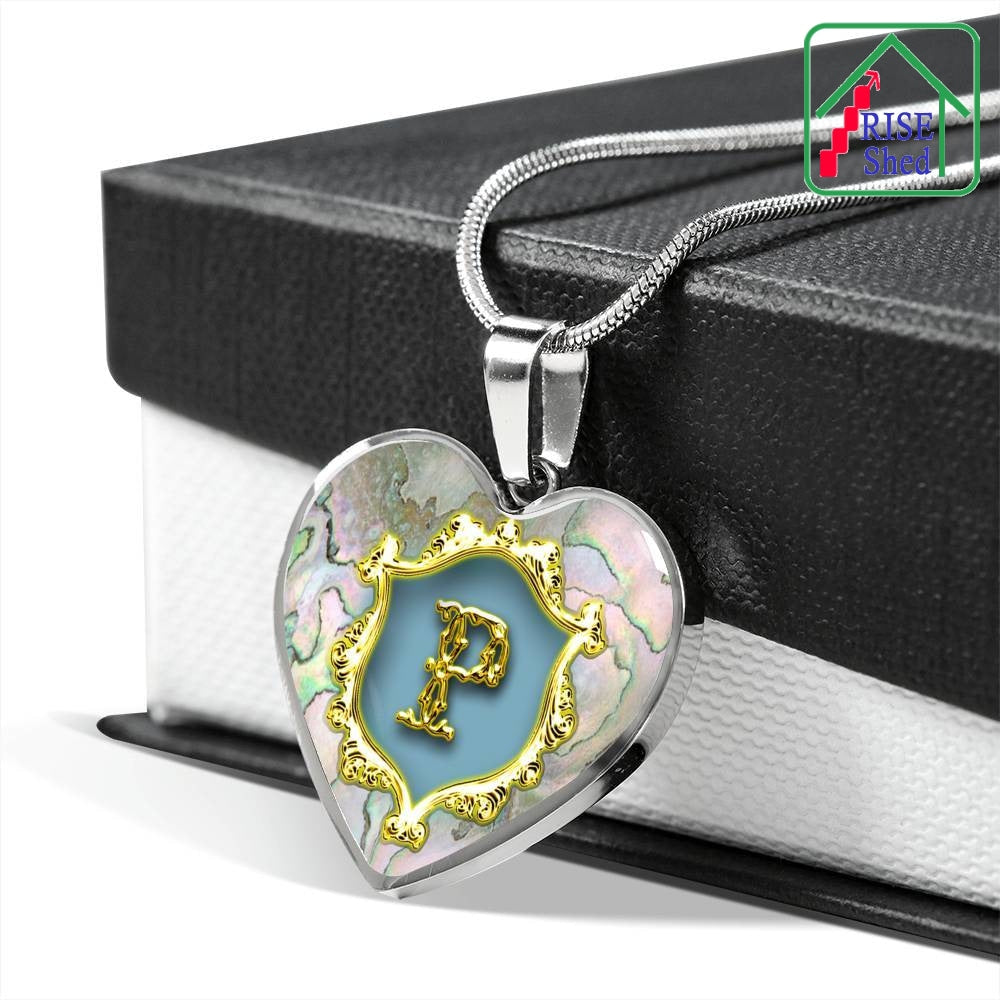 Valentines P Initial Monogram Heart Pendant on Necklace rests upon black and white giftbox