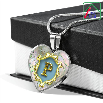 Valentines P Initial Monogram Heart Pendant on Necklace rests upon black and white giftbox