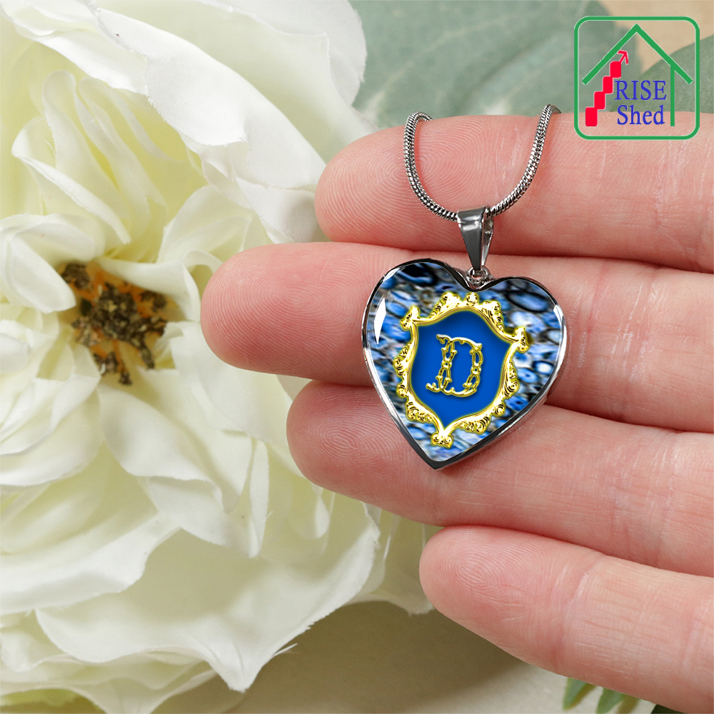 Valentines D Initial Monogram Heart Pendant from Necklace being held in palm of hand