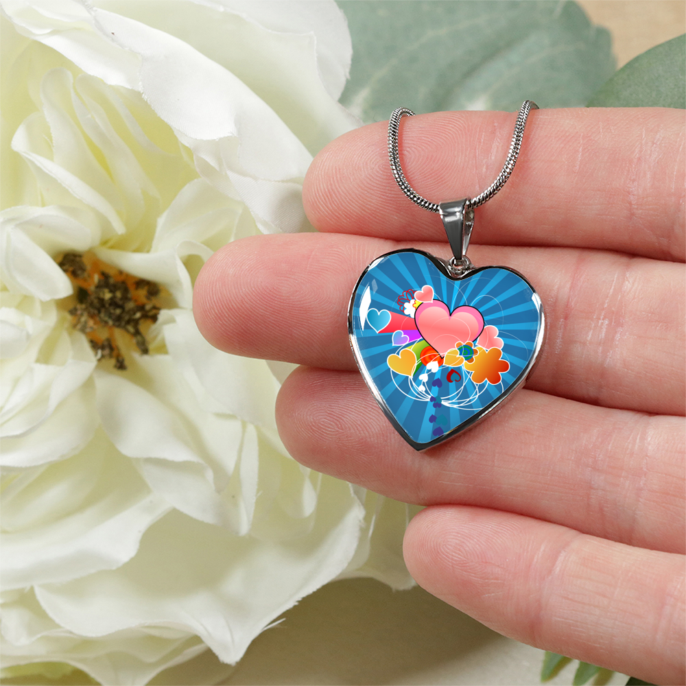 Heart Rays Of Love Charm Pendant Necklace being held in hand