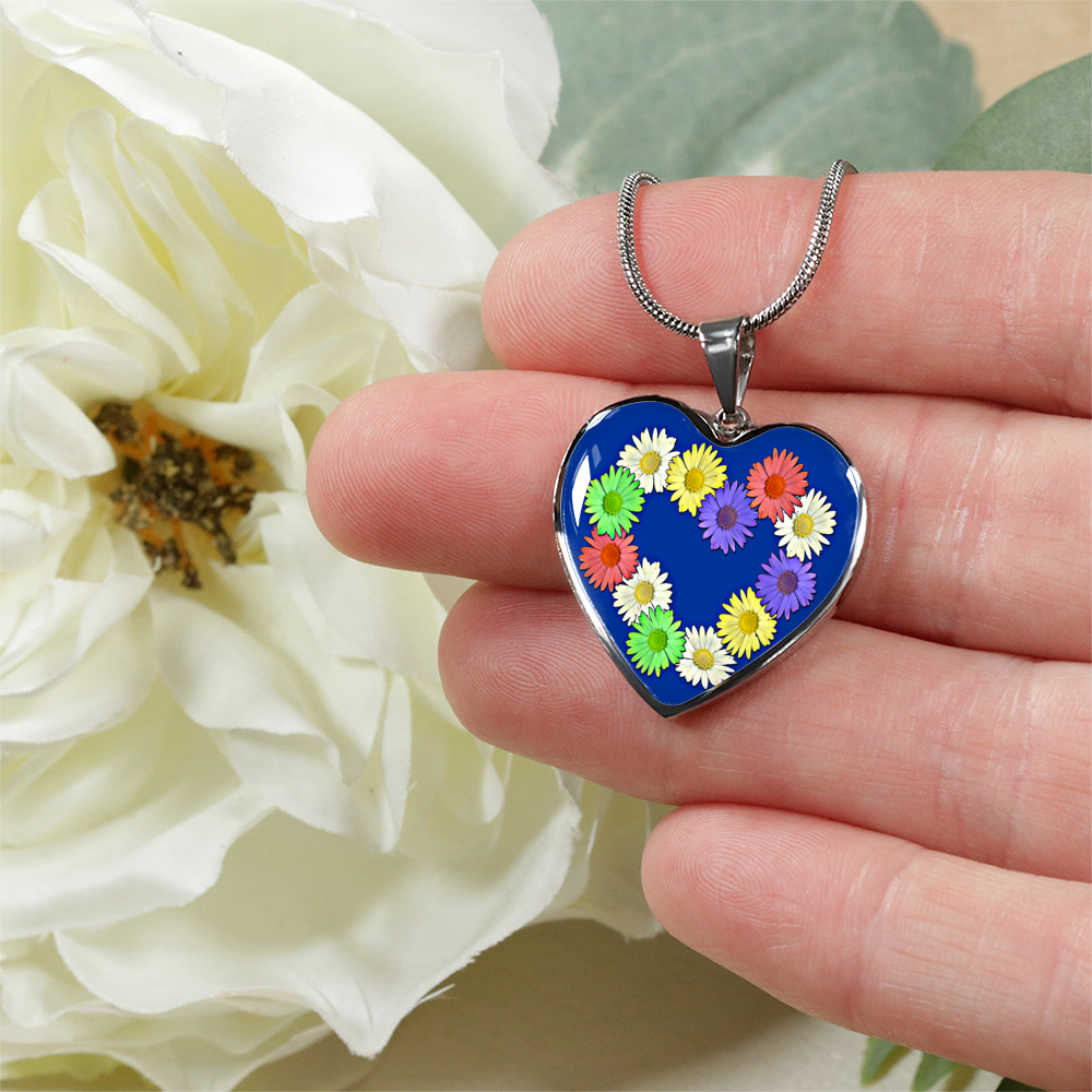 Daisy Chain Heart Pendant Necklace being held in hand