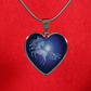 This unicorn is dancing at midnight in the moonlight of the full moon on a heart shaped pendant necklace