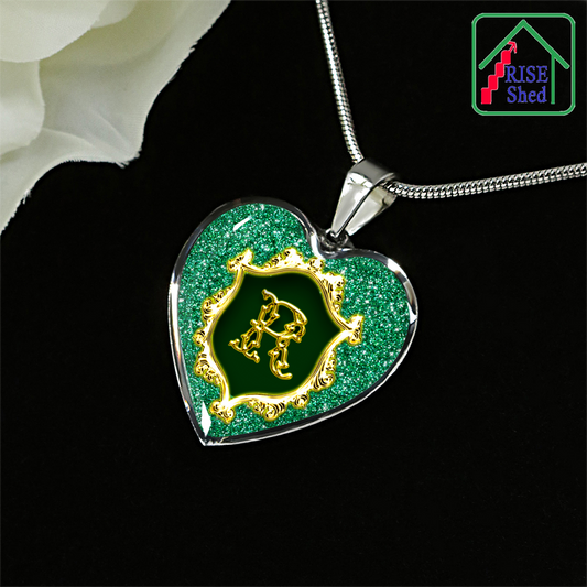 Initial R Monogram Heart Pendant from Necklace against Black Background