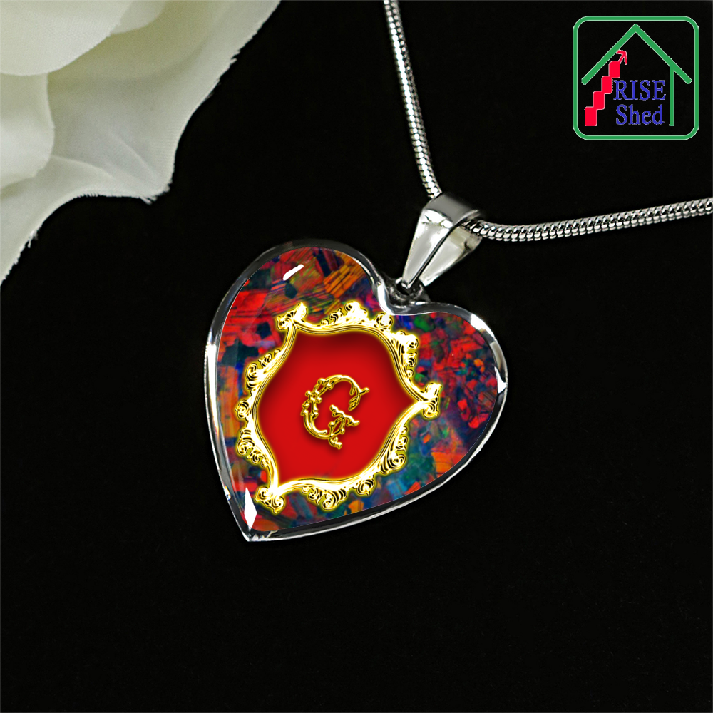 Valentines G Initial Monogram Heart Pendant Necklace rests against black background