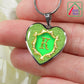 Alphabet Monogram Heart Pendant K Initial with Necklace being held against fingers on hand
