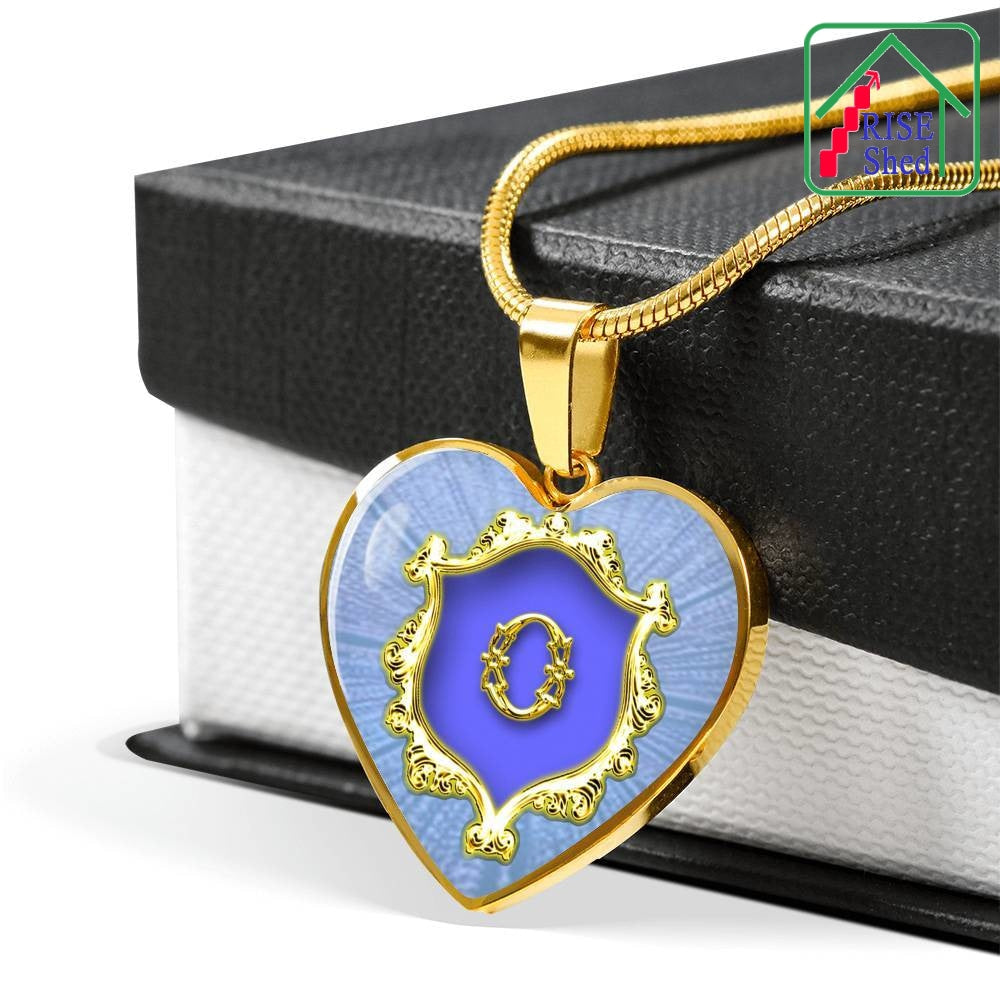 18K Gold Finish O Initial Monogram Alphabet Heart Pendant and Necklace draped over goftbox