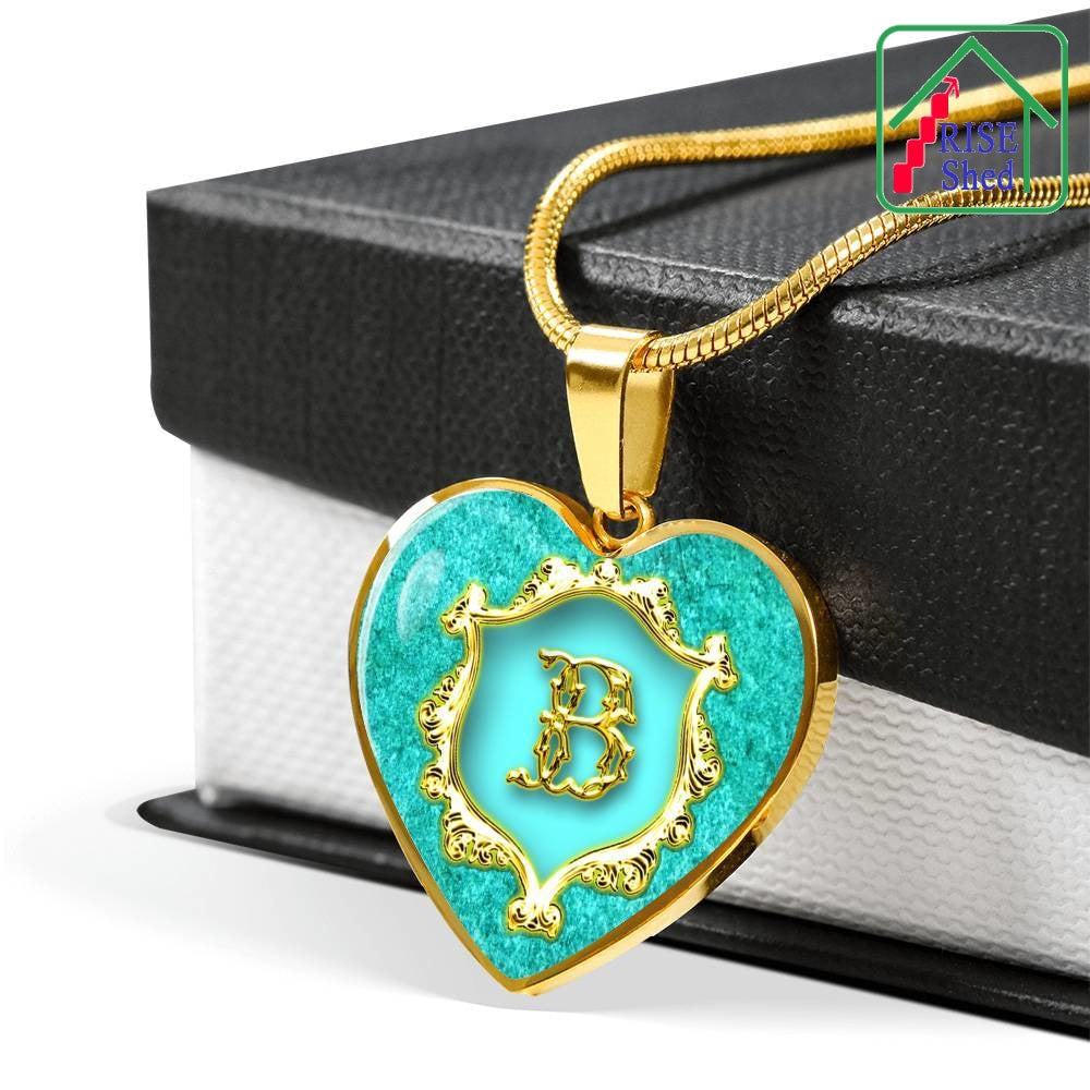 B Initial Monogram Alphabet 18K gold finsh Heart Pendant and Necklace draped over giftbox