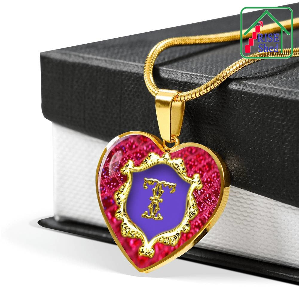 Alphabet Initial Necklace T Monogram 18K Gold Finish Heart Pendant lays over a giftbox with a black lid