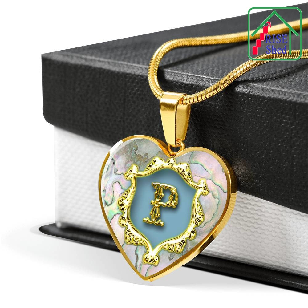 Valentines P Initial Monogram Heart Pendant Necklace lays upon luxury giftbox