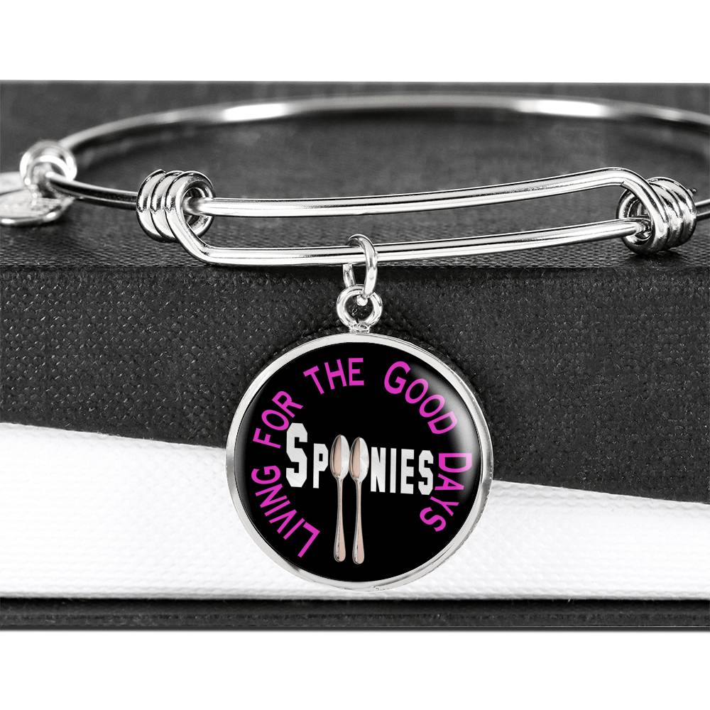 Spoonies - Living For The Good Days Bangle with charm hanging over a black and white gift box