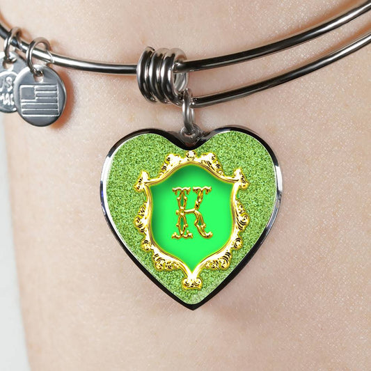 K Monogram Alphabet Initial Bangle Green Gold Glitter Style Background Heart Pendant on wrist