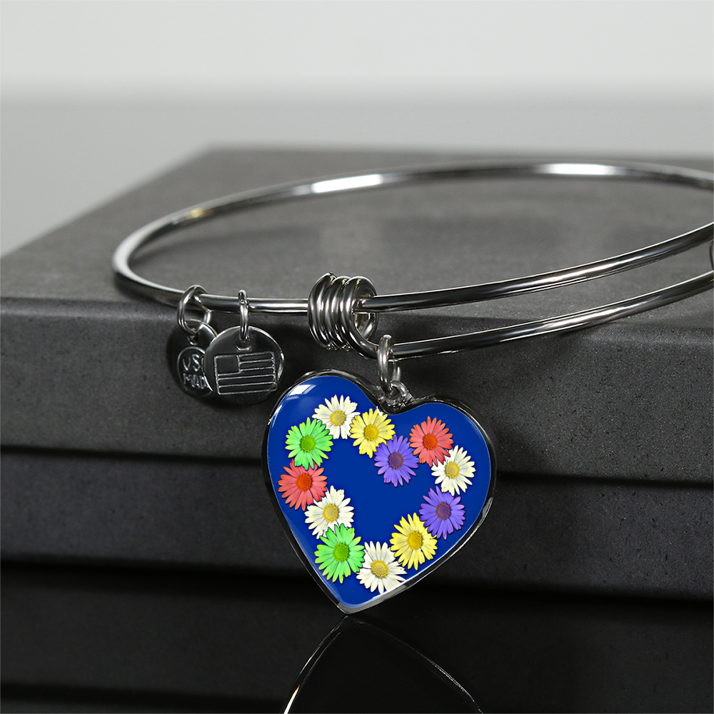 Daisy Chain Heart Pendant Bangle with Stainless Steel Finish sits up on gift box