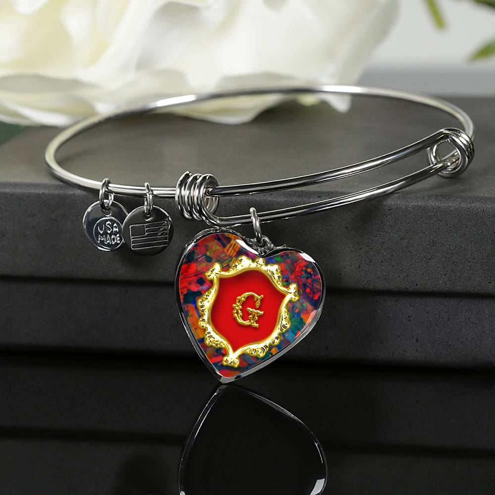 G Monogram Alphabet Initial Bangle Red Opal Style Background Heart Pendant is Displayed on Giftbox