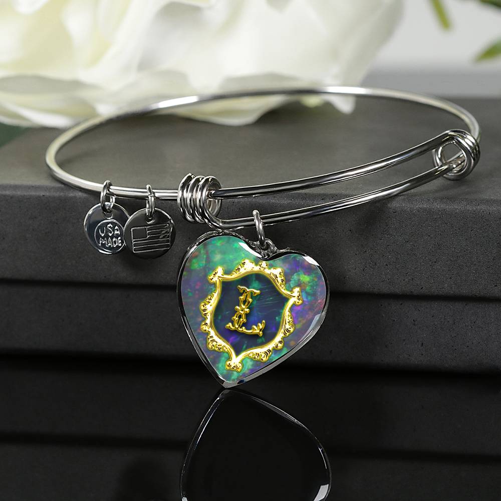 Heart Pendant Monograms L Alphabet Initial Bangle is draped over the giftbox