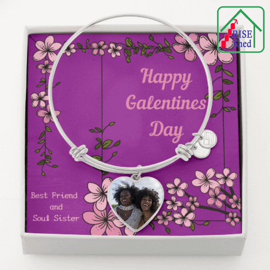Galentine's Day Best Friend and Soul Sister Photo Charm Bangle Stainless Steel with poured glass dome cover over a colored photo of two laughing dark skinned women with dark afro styled hair